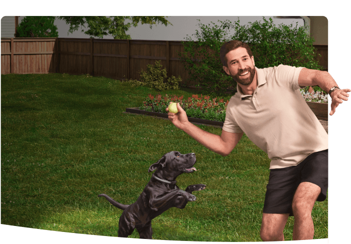 A man and his dog playing fetch